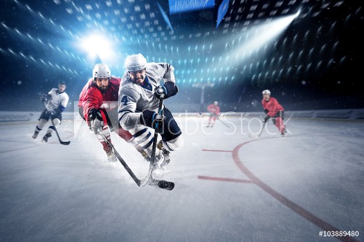 Picture of Hockey players shoots the puck and attacks